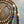 Collar estilo tibetano de madera con dije plateado cilíndrico con incrustaciones de barro - NALANDA | Tu motor de búsqueda interna